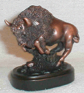 Figurine featuring a copper-colored running buffalo